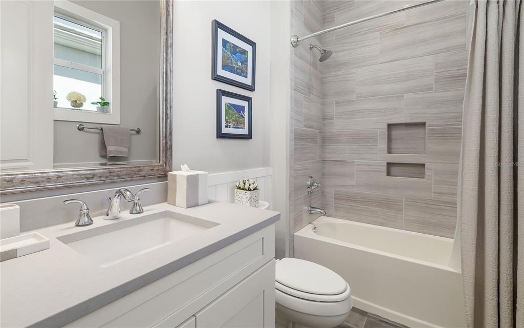 8362 Redonda Loop Bradenton, FL 34202 - Photo 29 of 58 a bathroom with a sink a toilet and shower