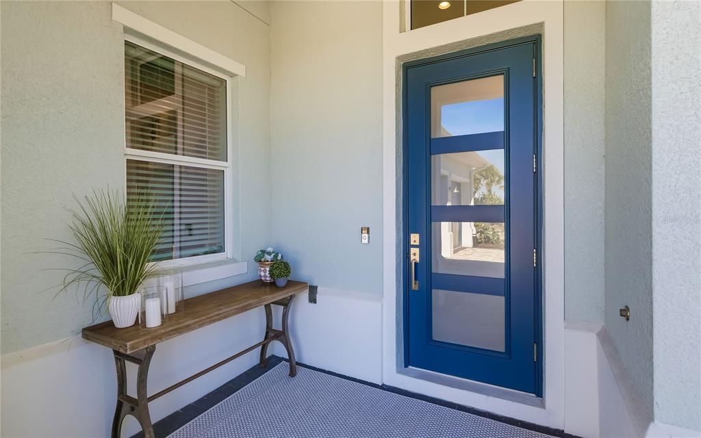 8362 Redonda Loop Bradenton, FL 34202 - Photo 3 of 58 a bench sitting in front of a door