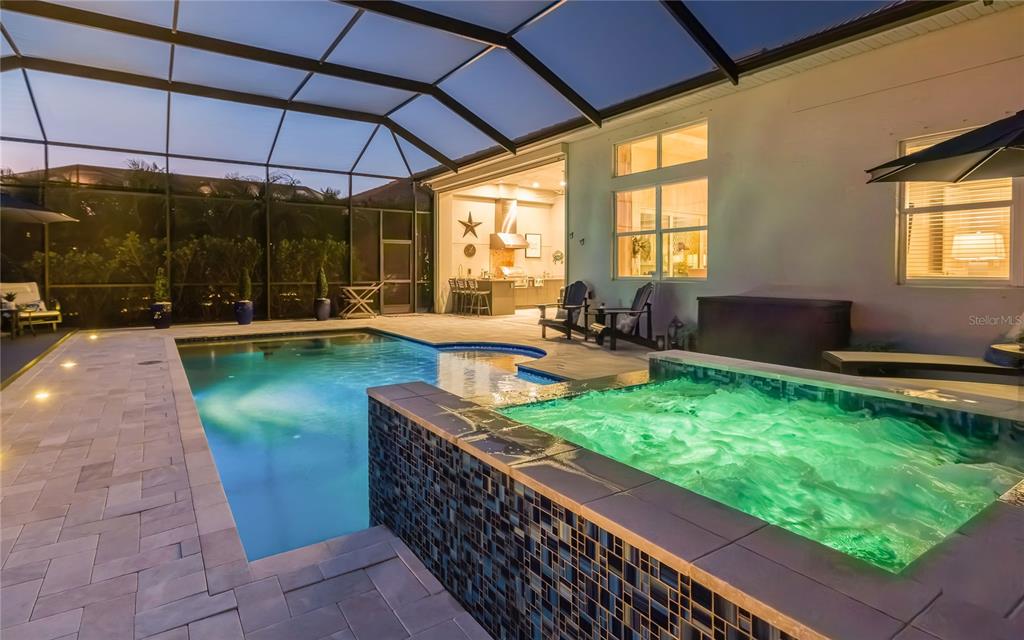 8362 Redonda Loop Bradenton, FL 34202 - Photo 37 of 58 a swimming pool with outdoor seating and yard