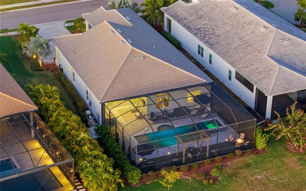 8362 Redonda Loop Bradenton, FL 34202 - Photo 40 of 58 an aerial view of a house with a yard