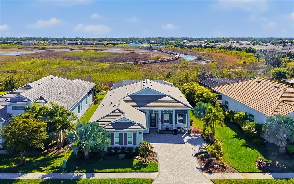 8362 Redonda Loop Bradenton, FL 34202 - Photo 41 of 58 an aerial view of a house with yard swimming pool and outdoor seating