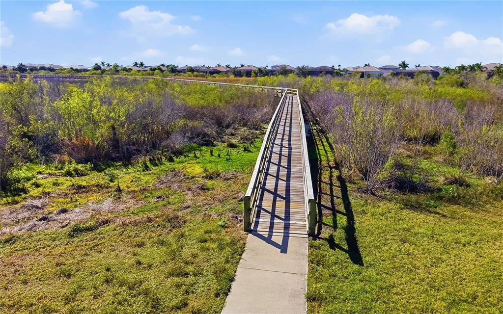 8362 Redonda Loop Bradenton, FL 34202 - Photo 45 of 58 a view of a lake with houses in the back