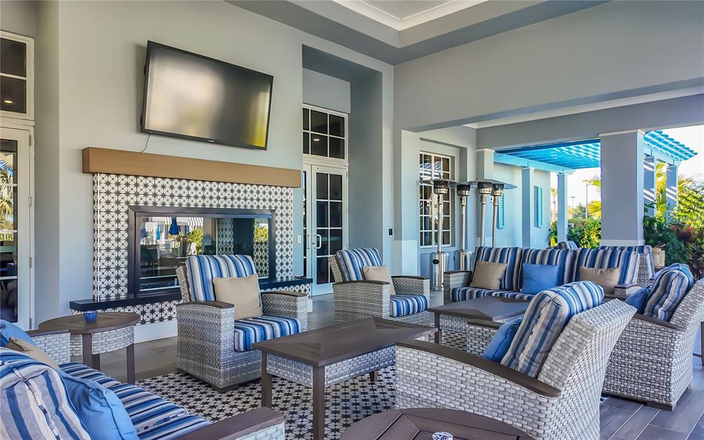 8362 Redonda Loop Bradenton, FL 34202 - Photo 51 of 58 a living room with furniture and a fireplace