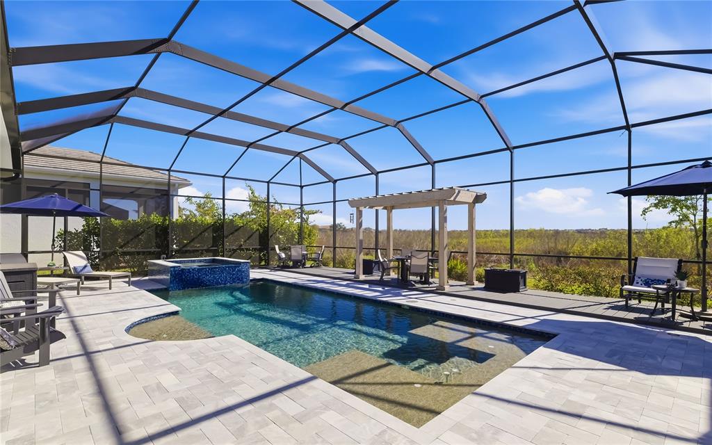 8362 Redonda Loop Bradenton, FL 34202 - Photo 7 of 58 a view of a swimming pool with a patio