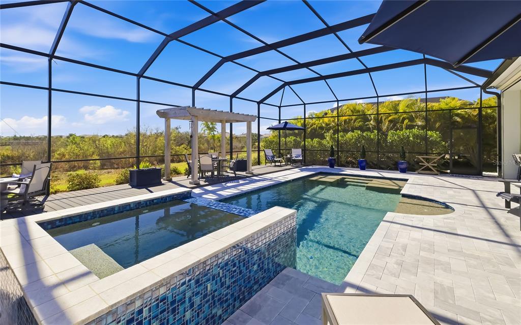 8362 Redonda Loop Bradenton, FL 34202 - Photo 9 of 58 a view of swimming pool with a patio