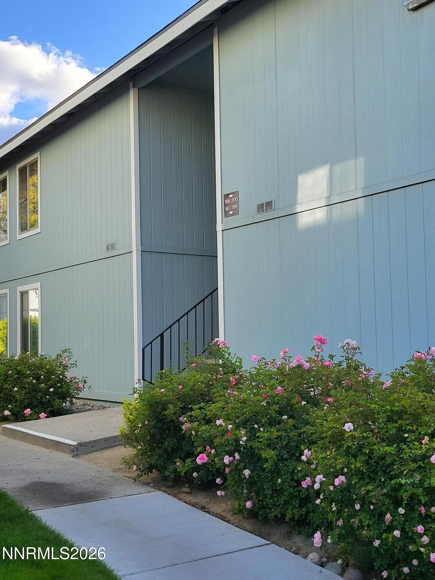 4606 Neil Road, Unit 197 Reno, NV 89502 - Photo 2 of 26 a flower plants in front of a door