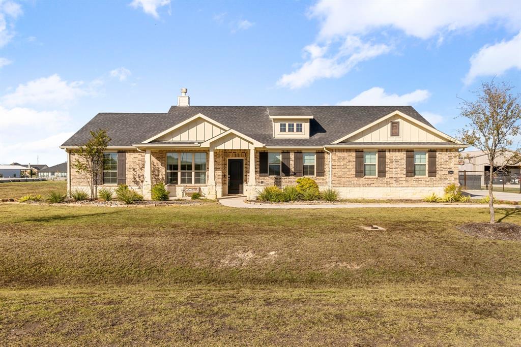 144 Ridgetop Trail Rhome, TX 76078 - Photo 1 of 1 Craftsman inspired home featuring a front yard