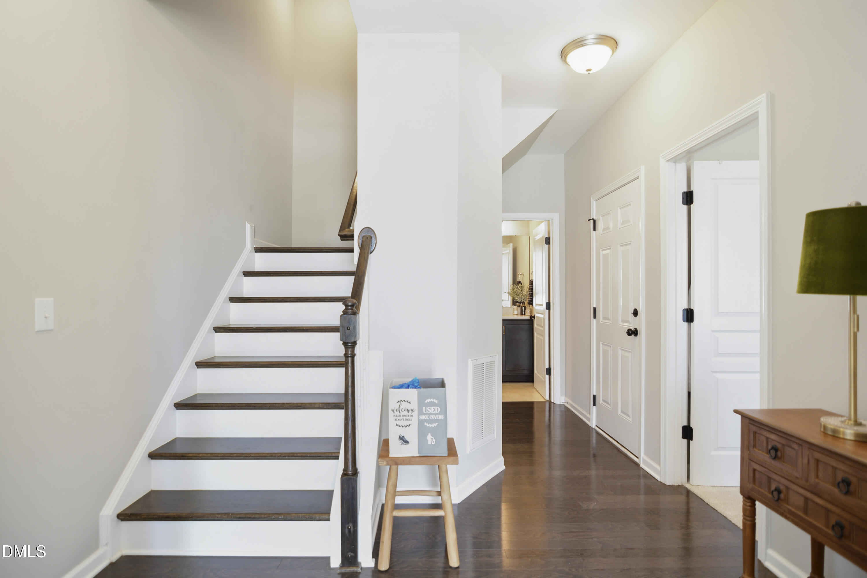 5916 Giddings Street Raleigh, NC 27616 - Photo 2 of 49 a view of entryway with wooden floor and staircase
