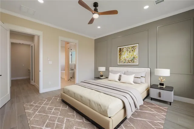 a bedroom with a bed and a chandelier