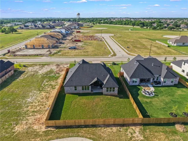 a view of swimming pool with a garden and seating area