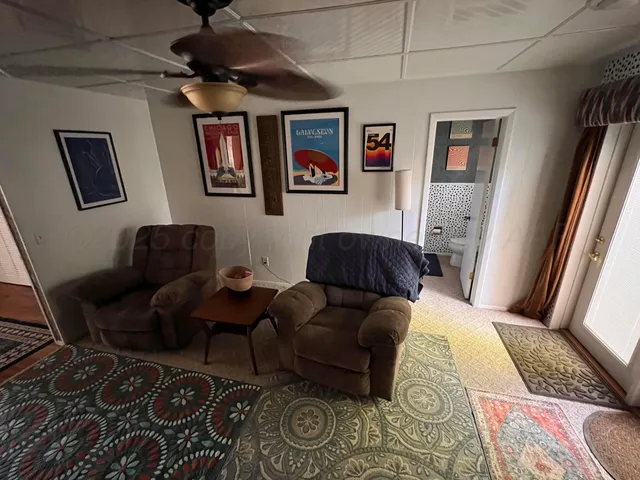 a bathroom with a toilet and a mirror