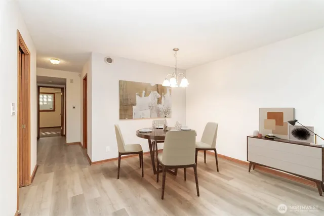 a view of a dining room with furniture window and wooden floor
