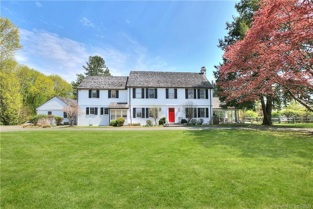 274 Chestnut Hill Road Wilton, CT 06897 - Photo 1 of 1 a view of a house with a big yard and large trees