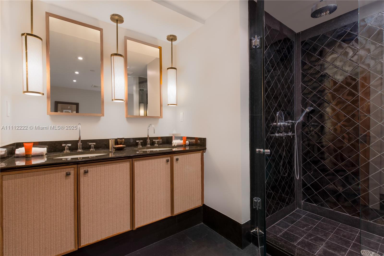 101 20th Street, Unit 2402 Miami Beach, FL 33139 - Photo 16 of 23 a bathroom with a sink and a mirror