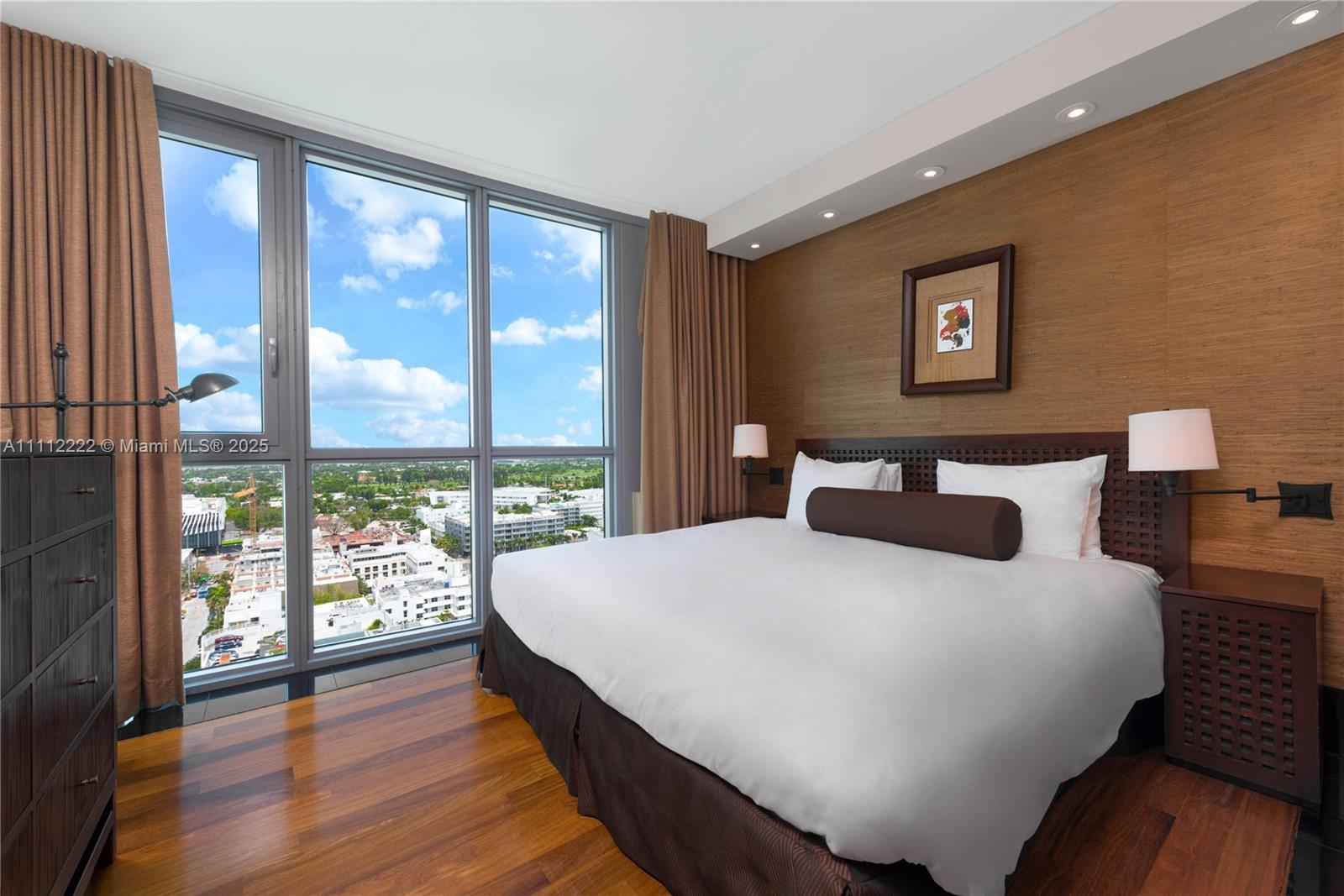 101 20th Street, Unit 2402 Miami Beach, FL 33139 - Photo 17 of 23 a bedroom with a large bed and a large window