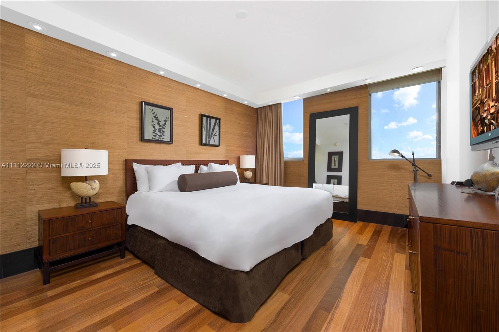 101 20th Street, Unit 2402 Miami Beach, FL 33139 - Photo 5 of 23 a bedroom with a bed and wooden floor