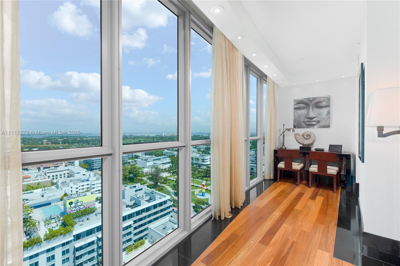 101 20th Street, Unit 2402 Miami Beach, FL 33139 - Photo 9 of 23 a view of a balcony with wooden floor