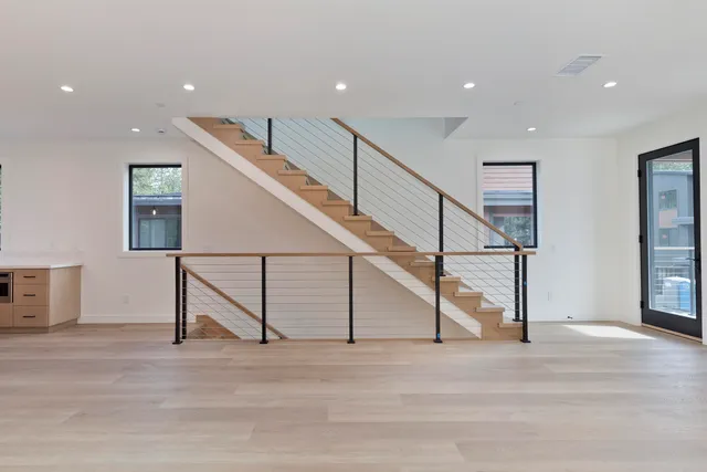 a view of entryway and hall with wooden floor