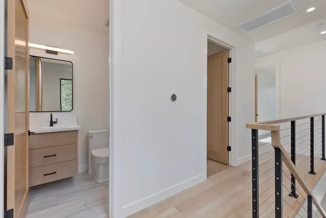 a view of a bathroom from the hallway