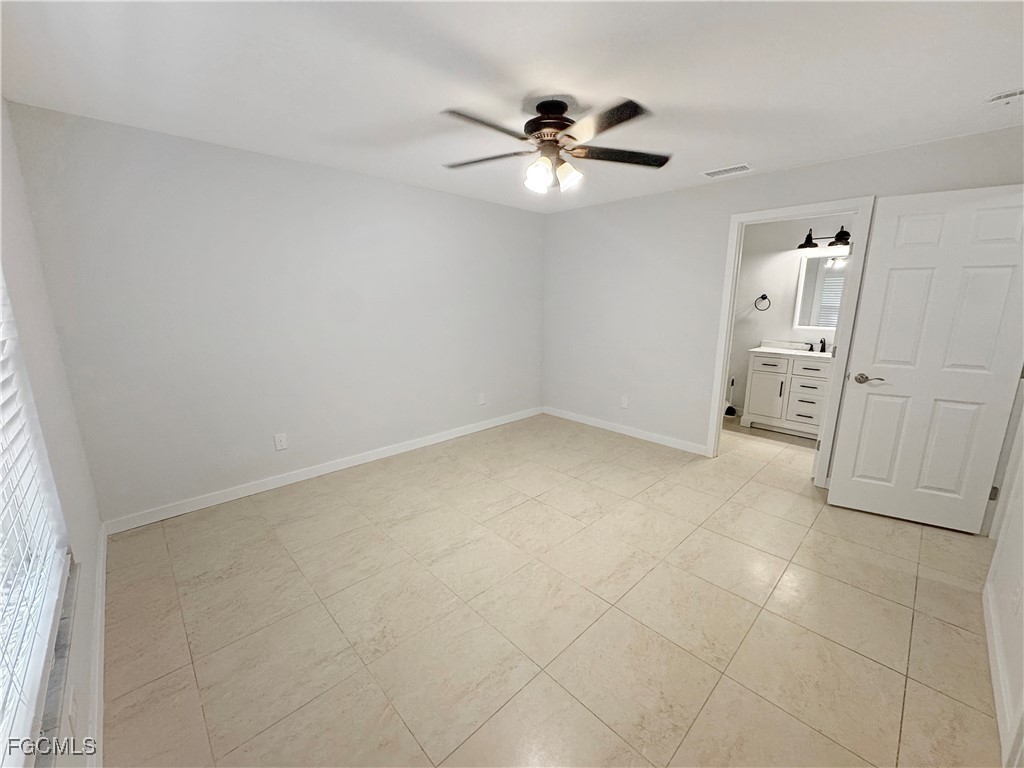 210 Manatee Street Fort Myers, FL 33913 - Photo 19 of 27 a view of a livingroom with a chandelier fan
