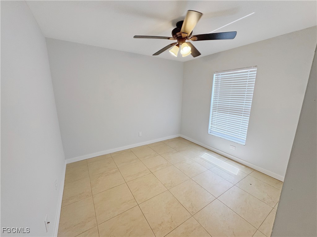 210 Manatee Street Fort Myers, FL 33913 - Photo 22 of 27 a view of an empty room with a window
