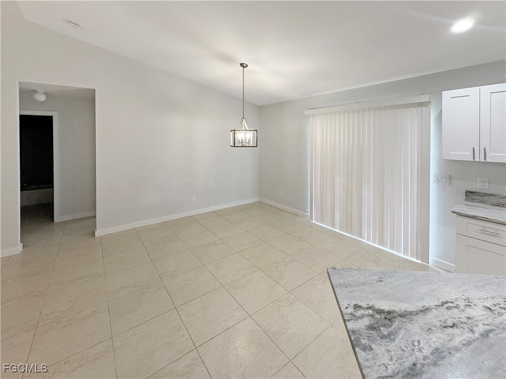 210 Manatee Street Fort Myers, FL 33913 - Photo 10 of 27 an empty room with cabinet and mirrors