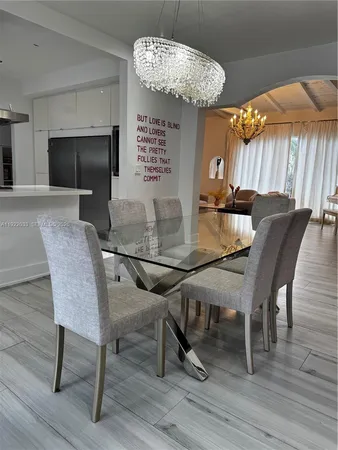 a bathroom with a toilet and a mirror