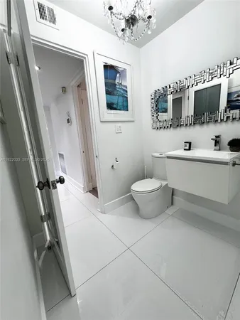 a view of a patio with table and chairs potted plants