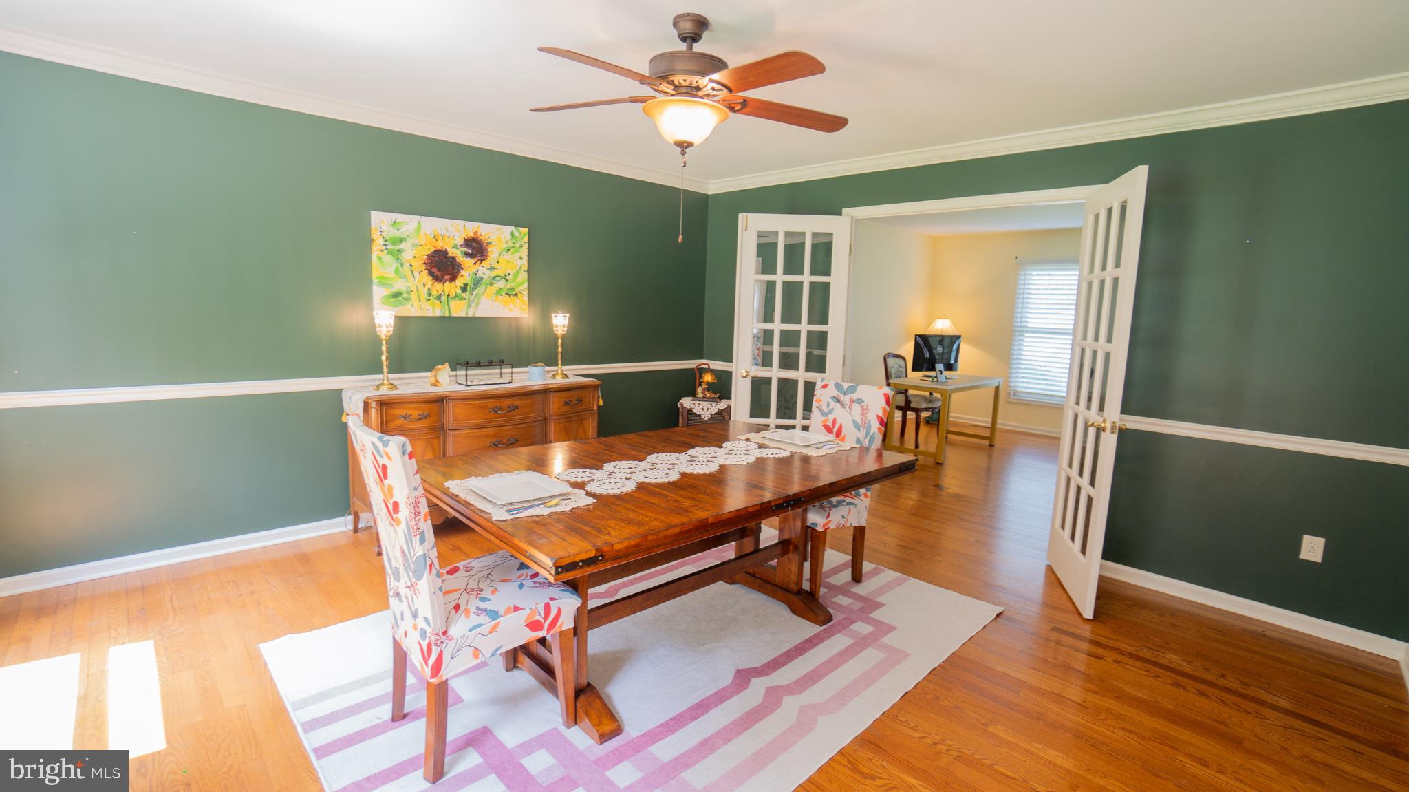 1042 Country Club Road Camp Hill, PA 17011 - Photo 12 of 41 a living room with furniture a table and wooden floor