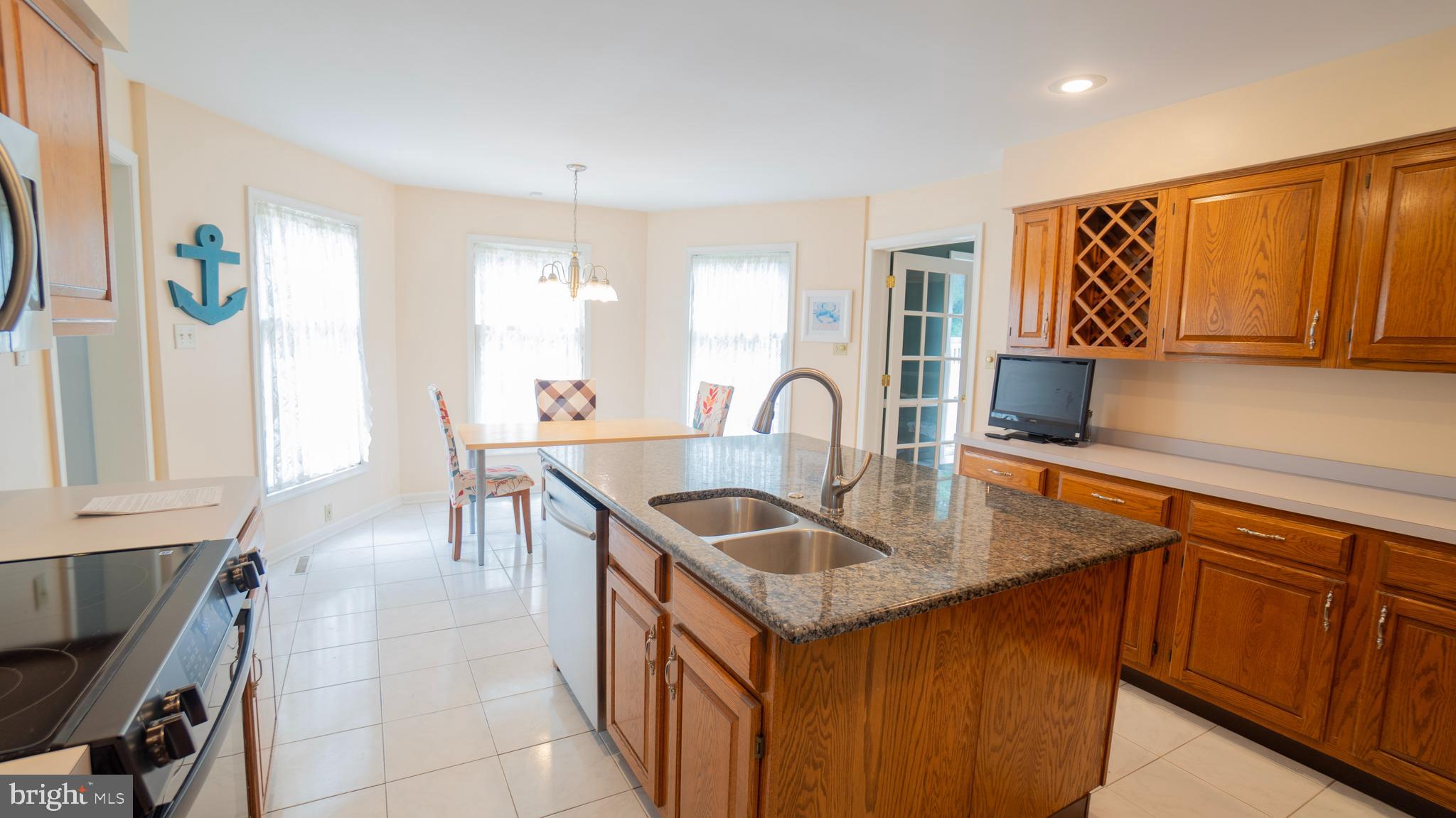 1042 Country Club Road Camp Hill, PA 17011 - Photo 15 of 41 a kitchen with stainless steel appliances granite countertop a sink and a refrigerator