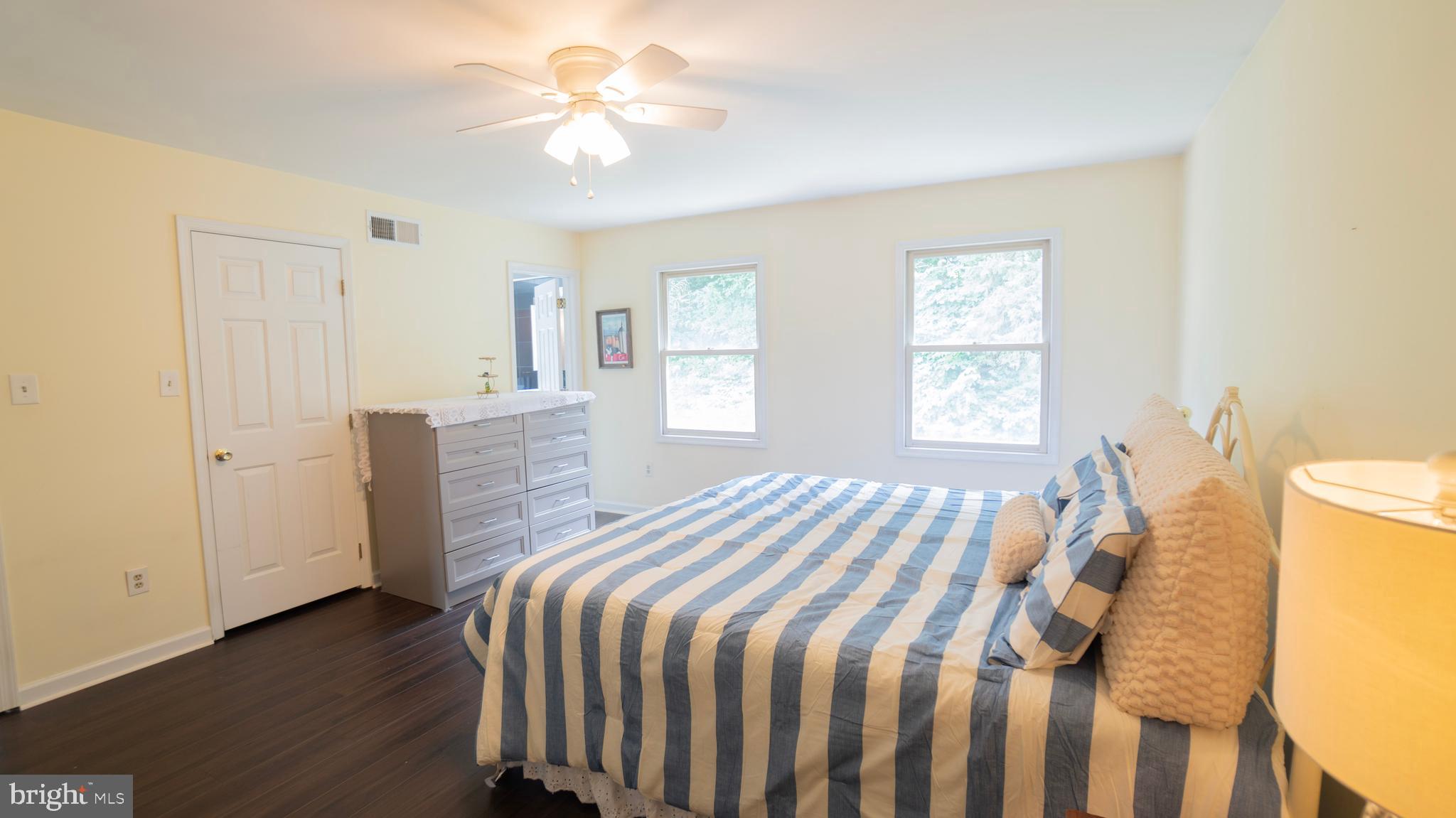 1042 Country Club Road Camp Hill, PA 17011 - Photo 21 of 41 a bedroom with a bed and a chandelier
