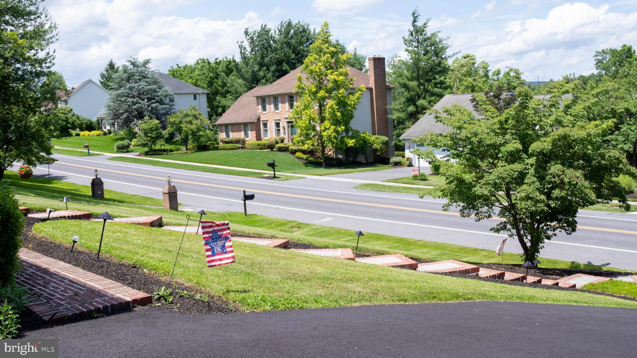 1042 Country Club Road Camp Hill, PA 17011 - Photo 3 of 41 a green field with lots of trees in the background