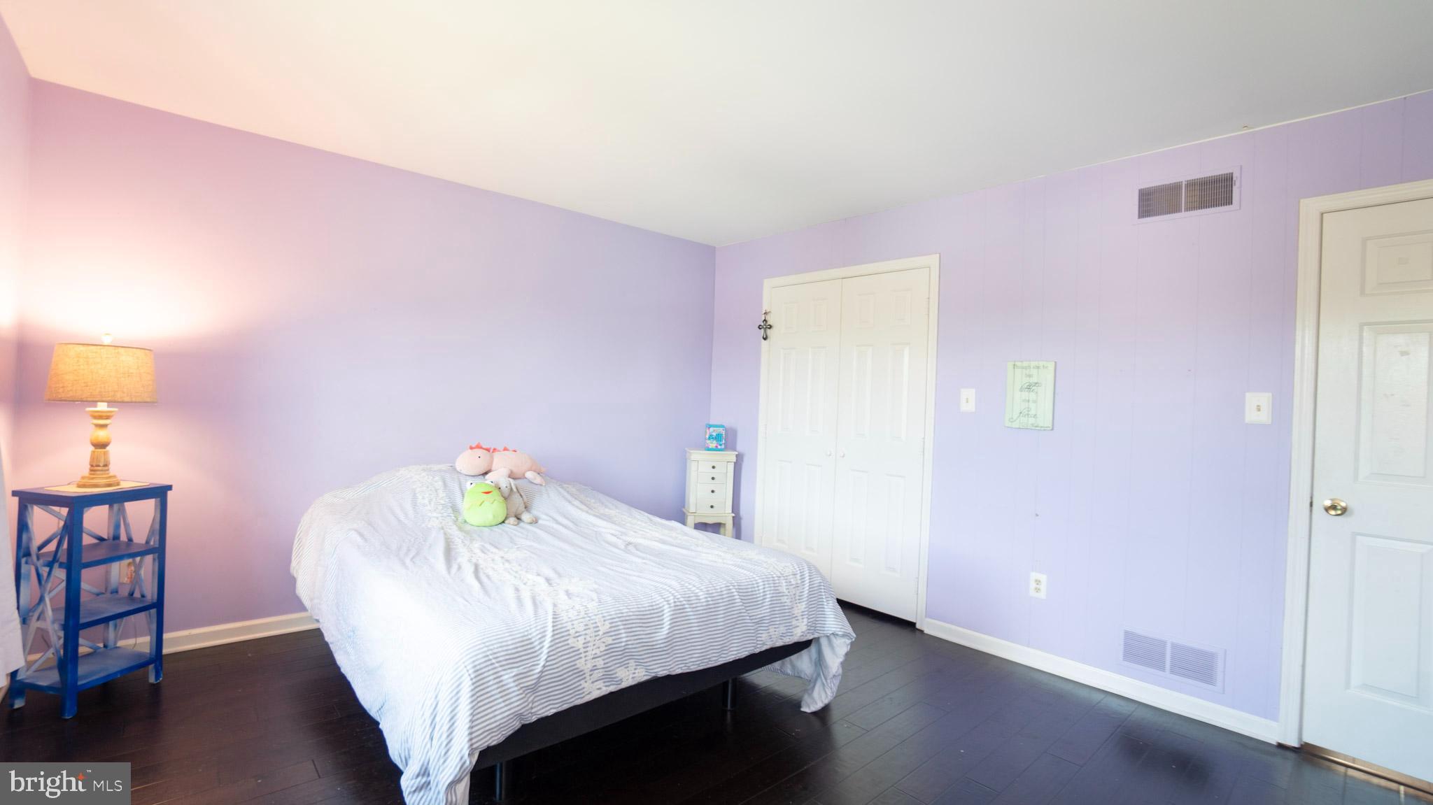 1042 Country Club Road Camp Hill, PA 17011 - Photo 31 of 41 a bedroom with a bed and wooden floor