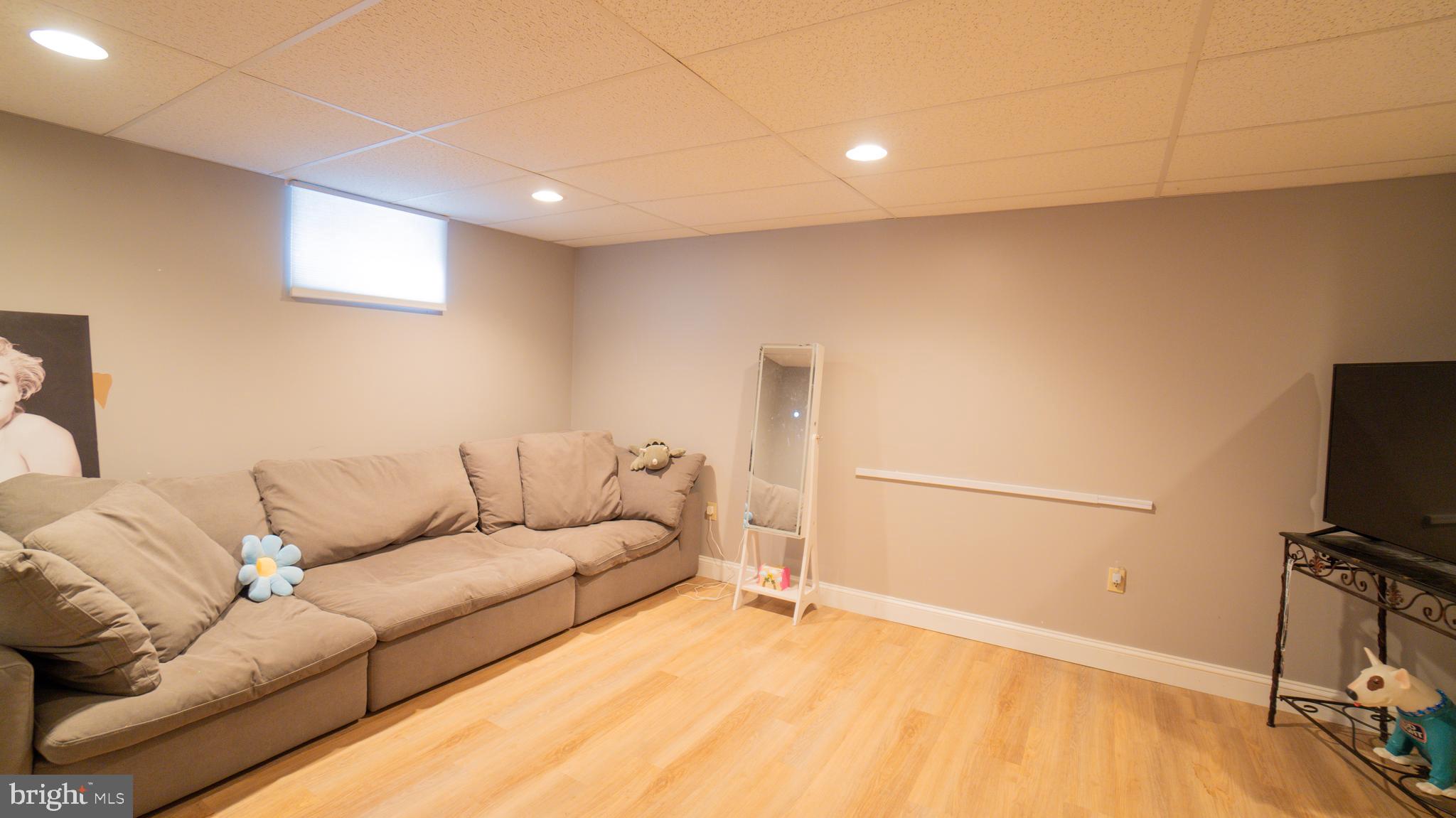 1042 Country Club Road Camp Hill, PA 17011 - Photo 34 of 41 a living room with furniture and a flat screen tv