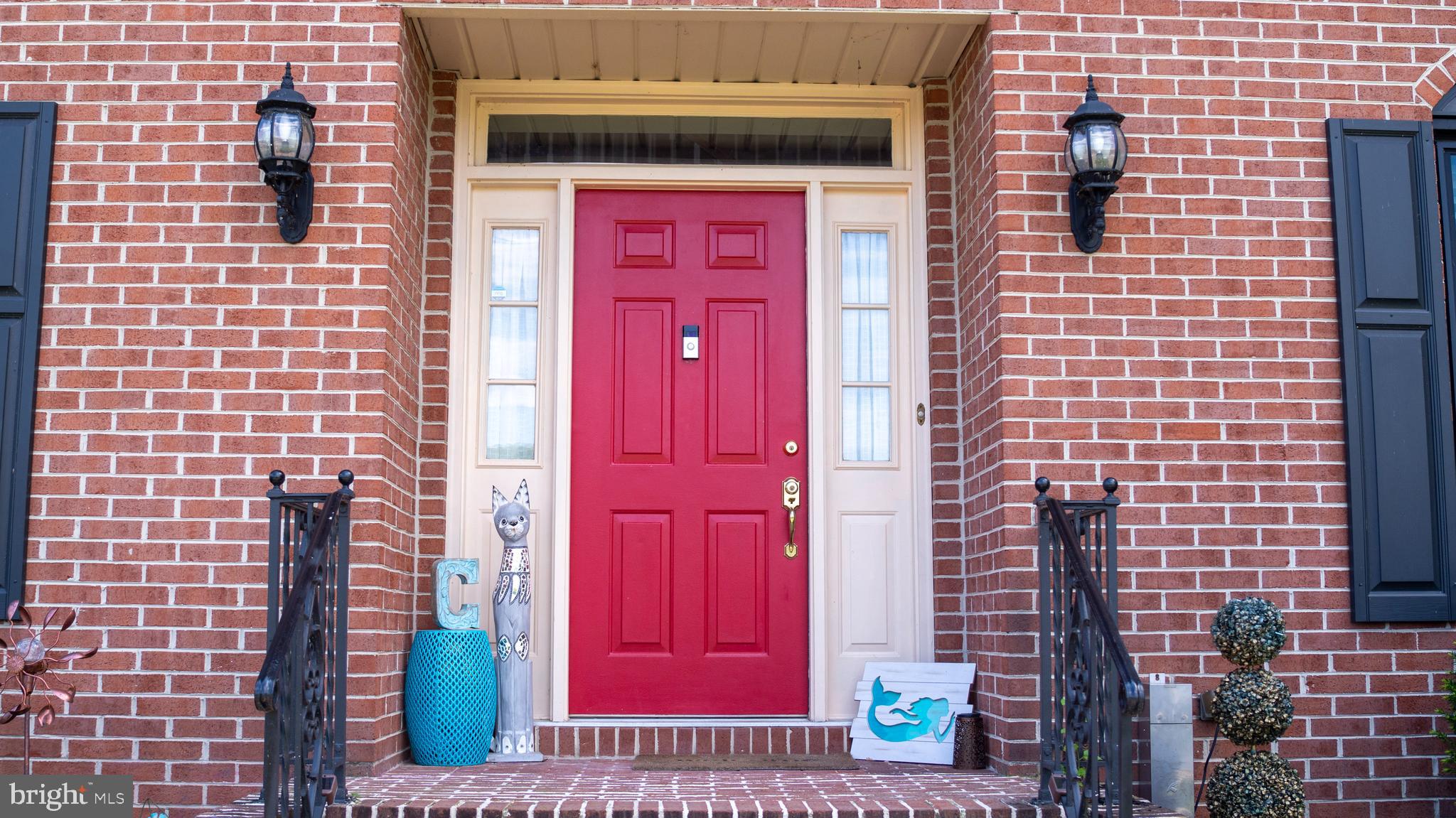 1042 Country Club Road Camp Hill, PA 17011 - Photo 5 of 41 a view of a brick building with red door