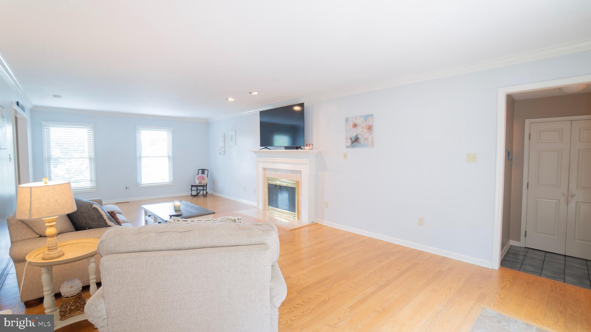1042 Country Club Road Camp Hill, PA 17011 - Photo 10 of 41 a living room with furniture a flat screen tv and a fireplace