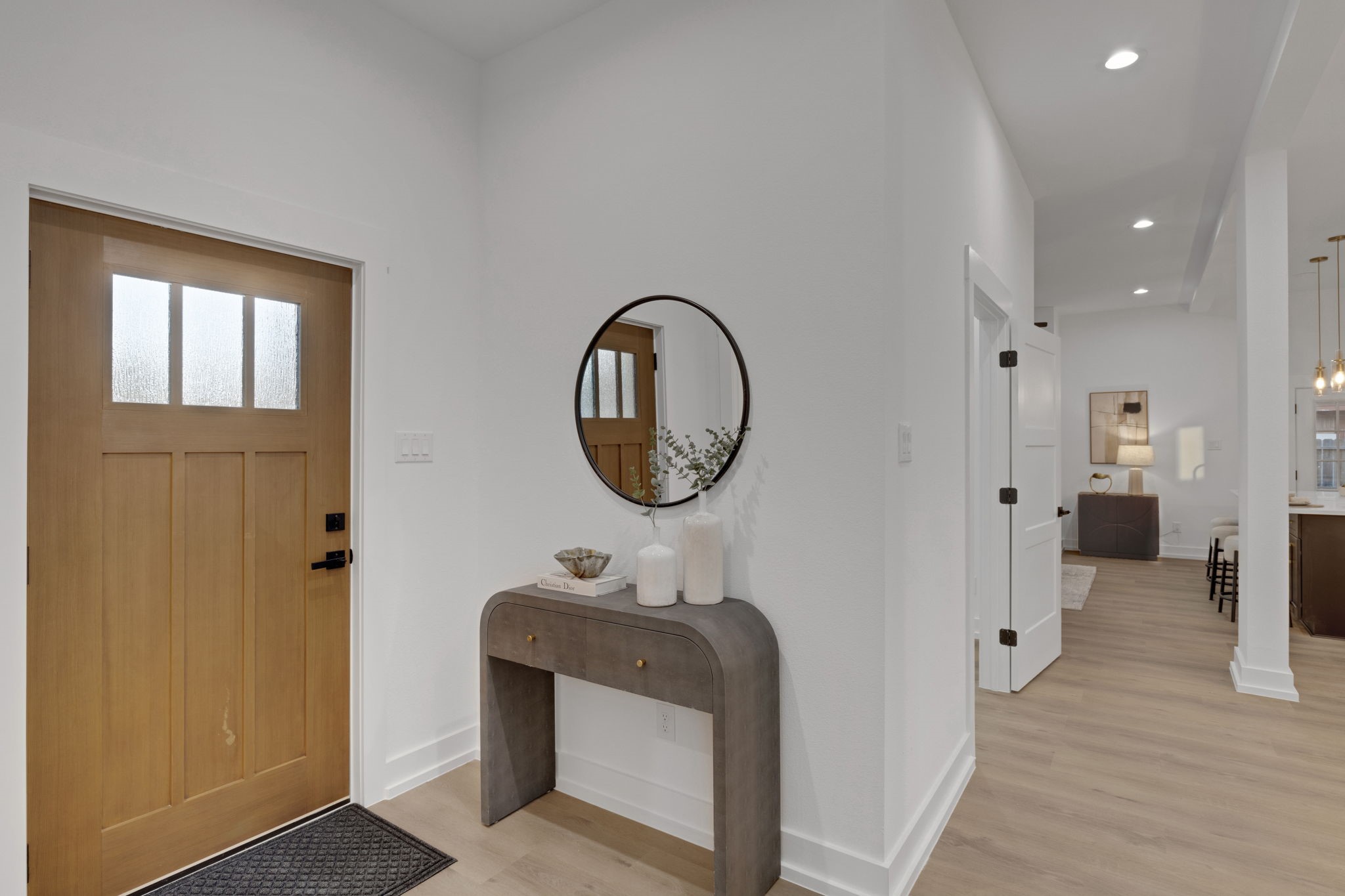 4202 Plaag Street Houston, TX 77016 - Photo 5 of 38 Welcoming foyer with natural wood accents and open staircase leading to the second level.