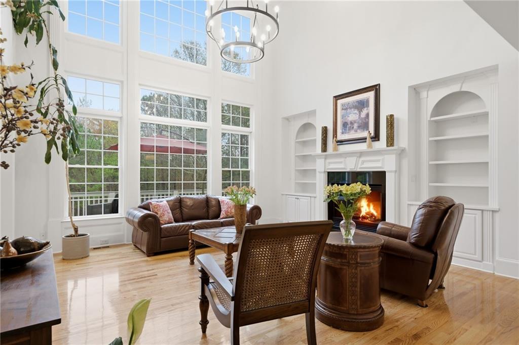 2058 Windermere Crossing Cumming, GA 30041 - Photo 13 of 75 a living room with furniture and a fireplace