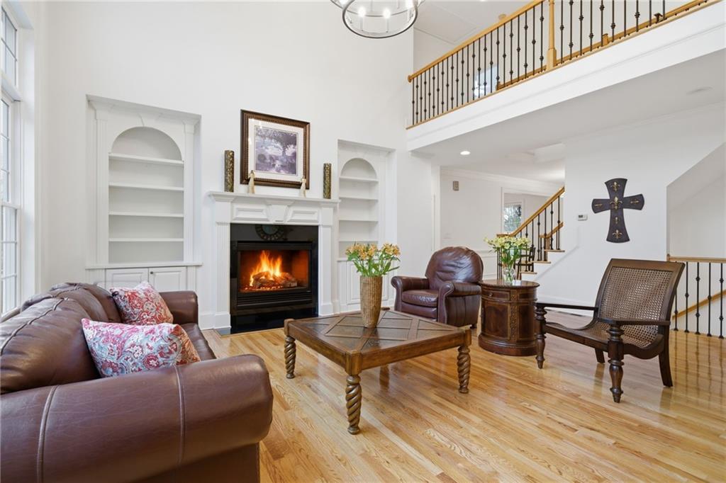 2058 Windermere Crossing Cumming, GA 30041 - Photo 14 of 75 a living room with furniture and a fireplace