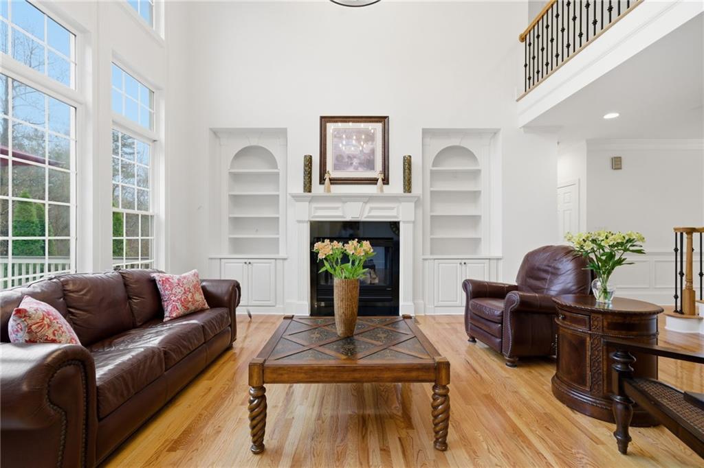 2058 Windermere Crossing Cumming, GA 30041 - Photo 16 of 75 a living room with furniture and a fireplace