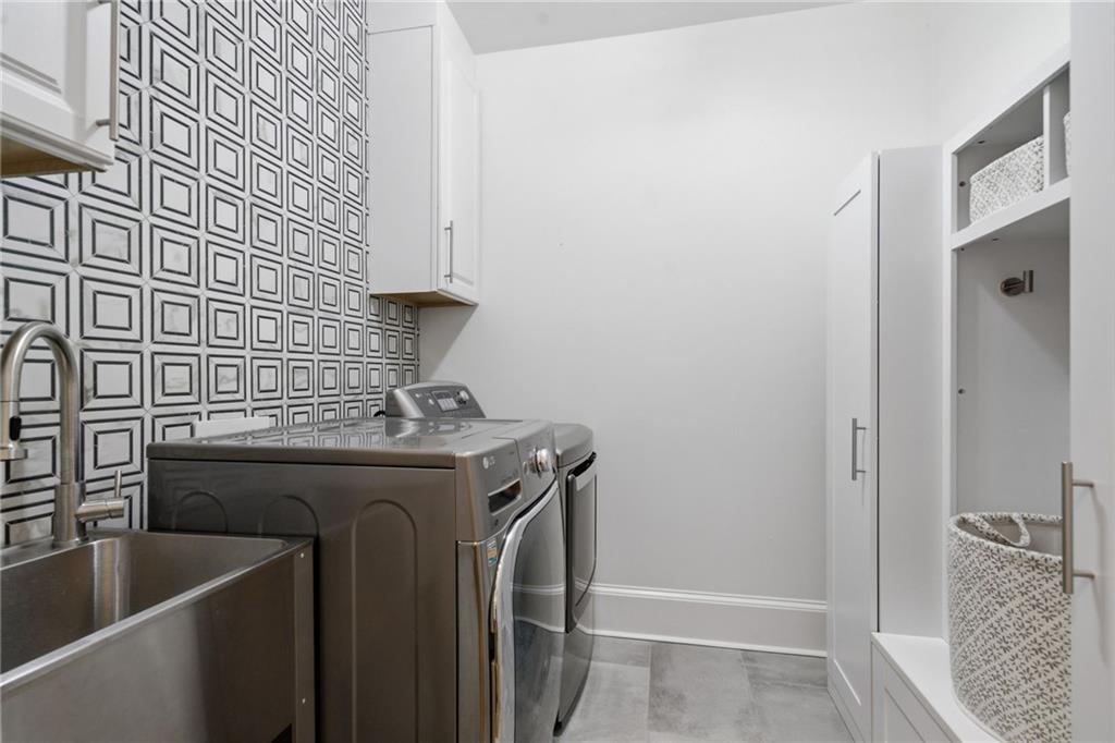 2058 Windermere Crossing Cumming, GA 30041 - Photo 23 of 75 a utility room with dryer and washer