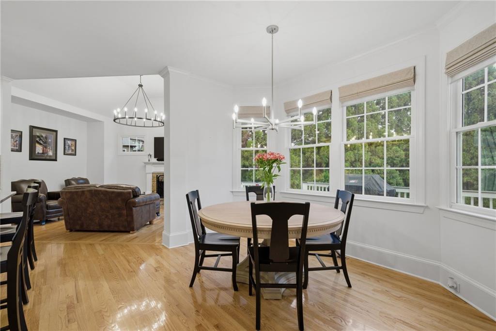 2058 Windermere Crossing Cumming, GA 30041 - Photo 26 of 75 a view of a dining room with furniture window and wooden floor