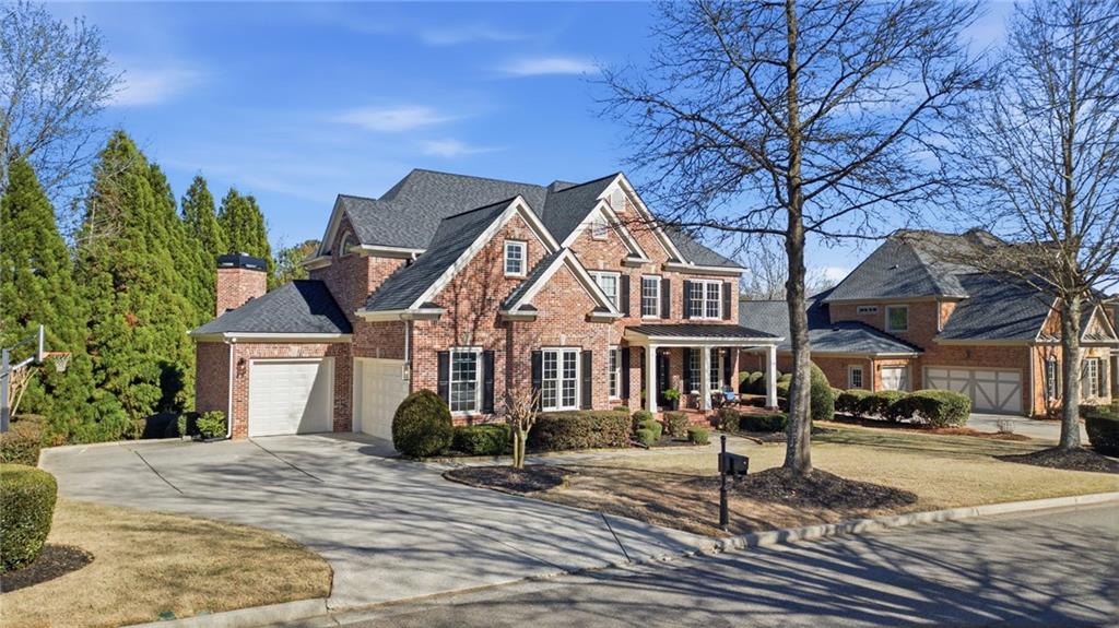2058 Windermere Crossing Cumming, GA 30041 - Photo 3 of 75 a front view of a house with a yard