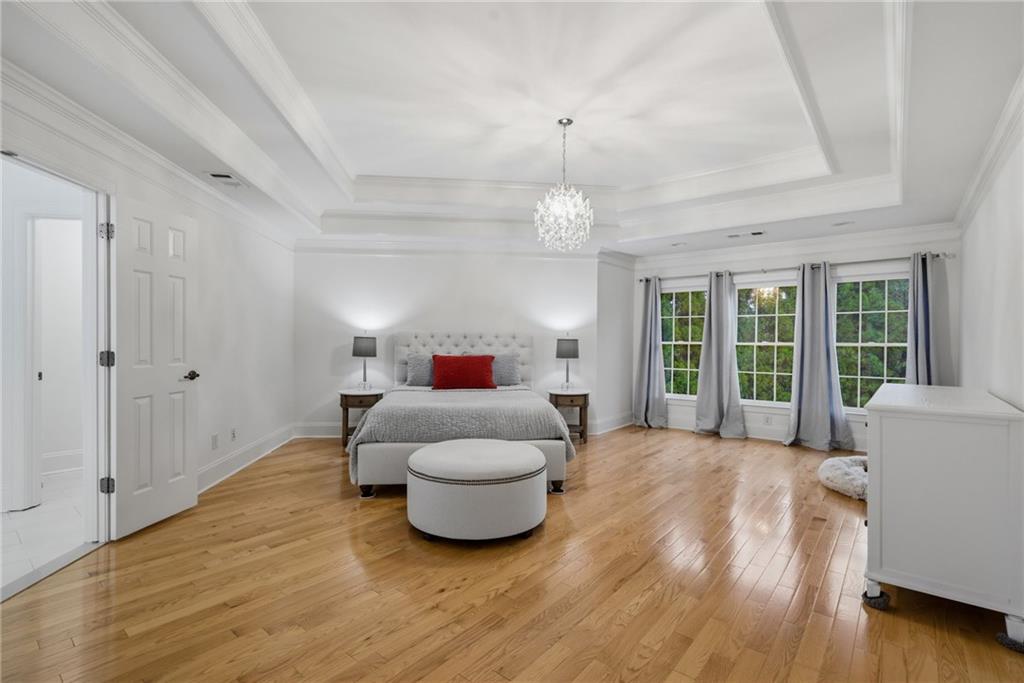2058 Windermere Crossing Cumming, GA 30041 - Photo 35 of 75 a living room with furniture and a large window