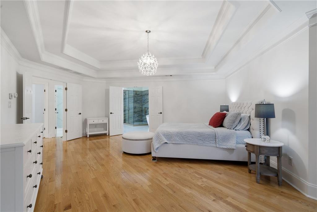 2058 Windermere Crossing Cumming, GA 30041 - Photo 37 of 75 a living room with furniture and a chandelier