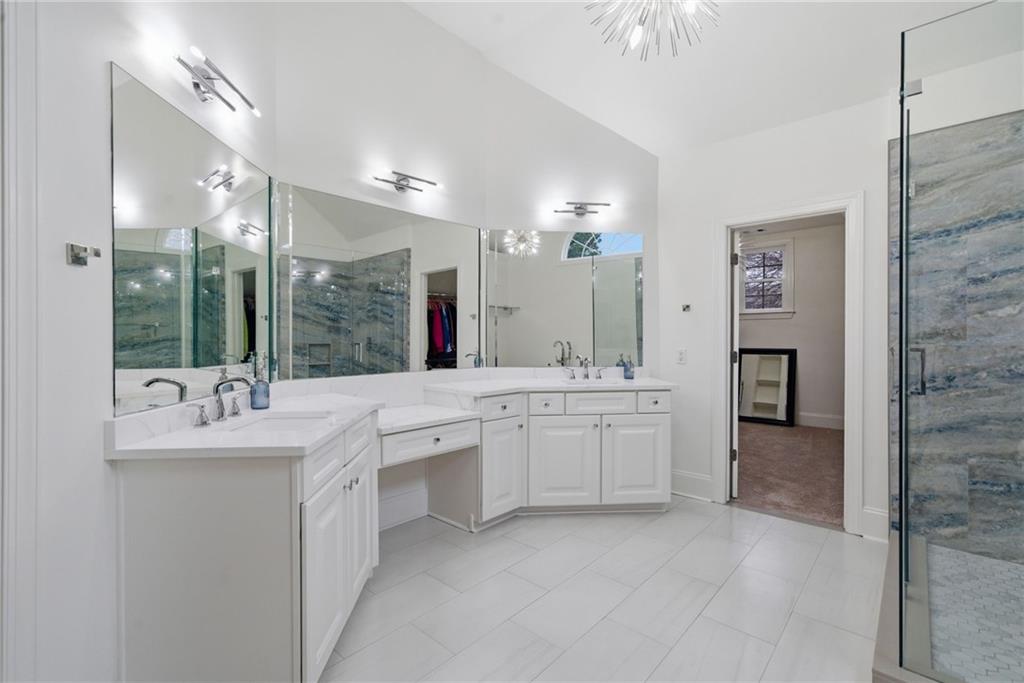 2058 Windermere Crossing Cumming, GA 30041 - Photo 38 of 75 a large white kitchen with a sink and dishwasher with a large kitchen island