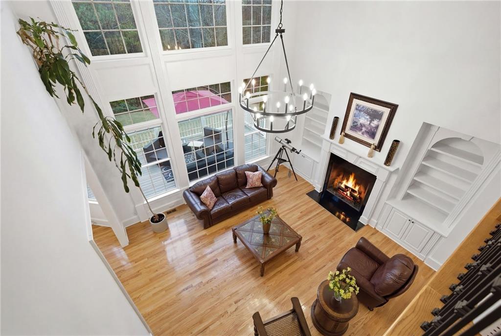 2058 Windermere Crossing Cumming, GA 30041 - Photo 43 of 75 a living room with furniture and a fireplace