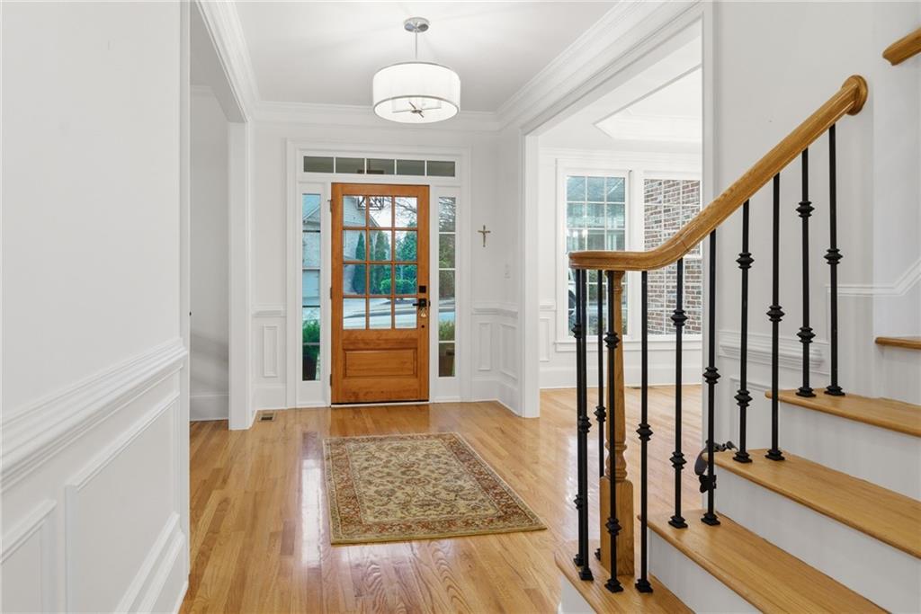 2058 Windermere Crossing Cumming, GA 30041 - Photo 5 of 75 a view of an entryway with wooden floor and door