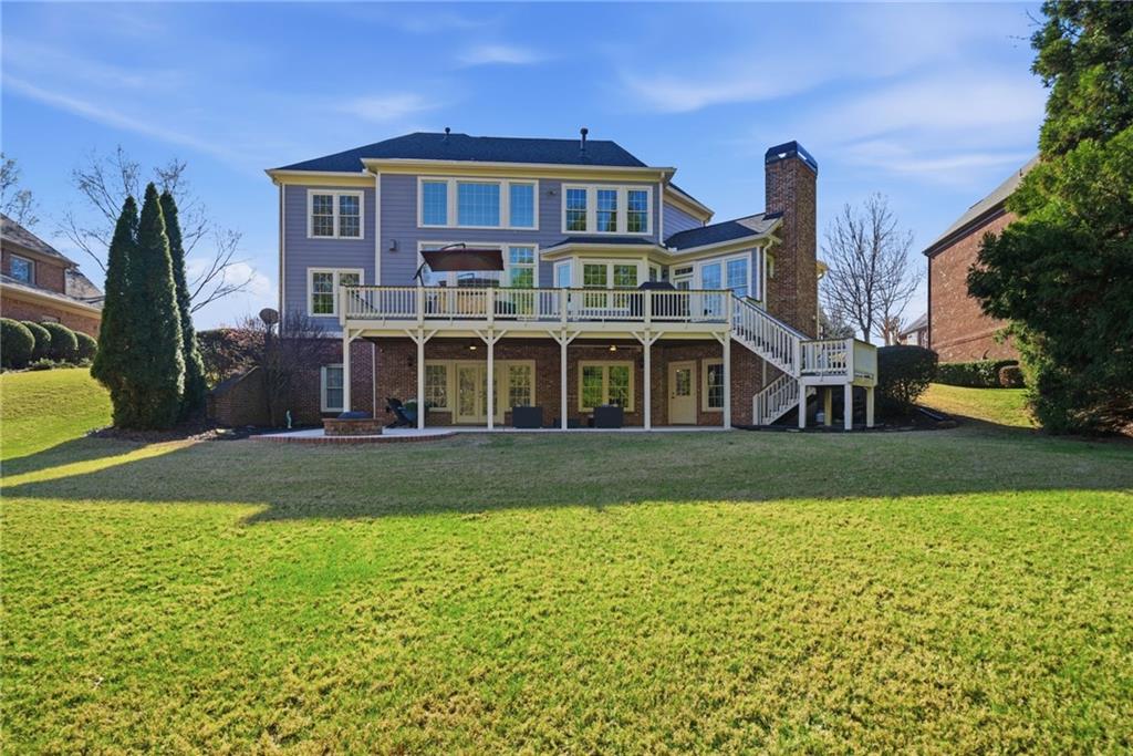 2058 Windermere Crossing Cumming, GA 30041 - Photo 54 of 75 a front view of a house with a yard