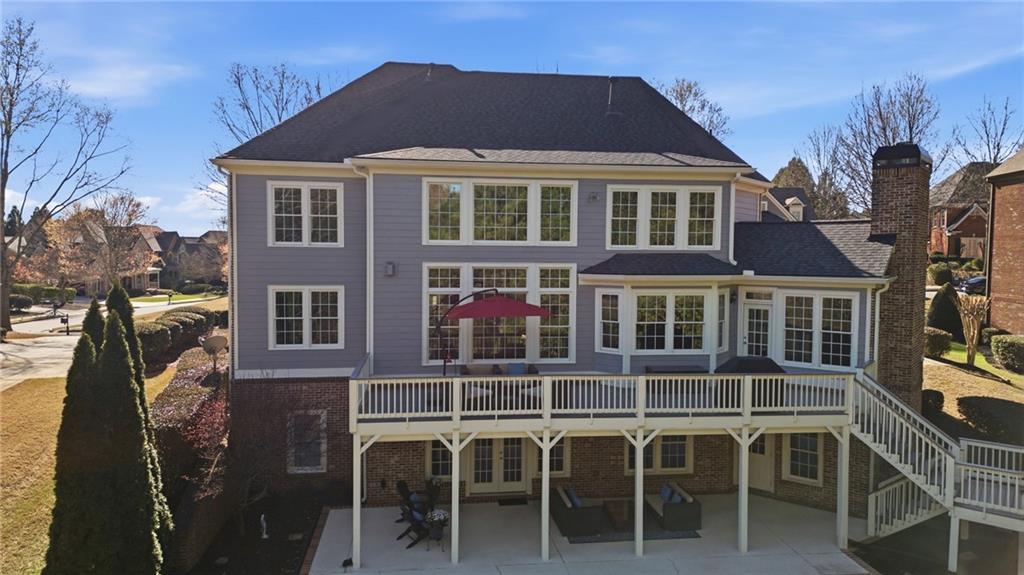 2058 Windermere Crossing Cumming, GA 30041 - Photo 57 of 75 a front view of a house with a yard